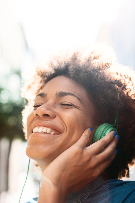 These 13 Feel-Good Podcasts Will Bring Joy to Your Day